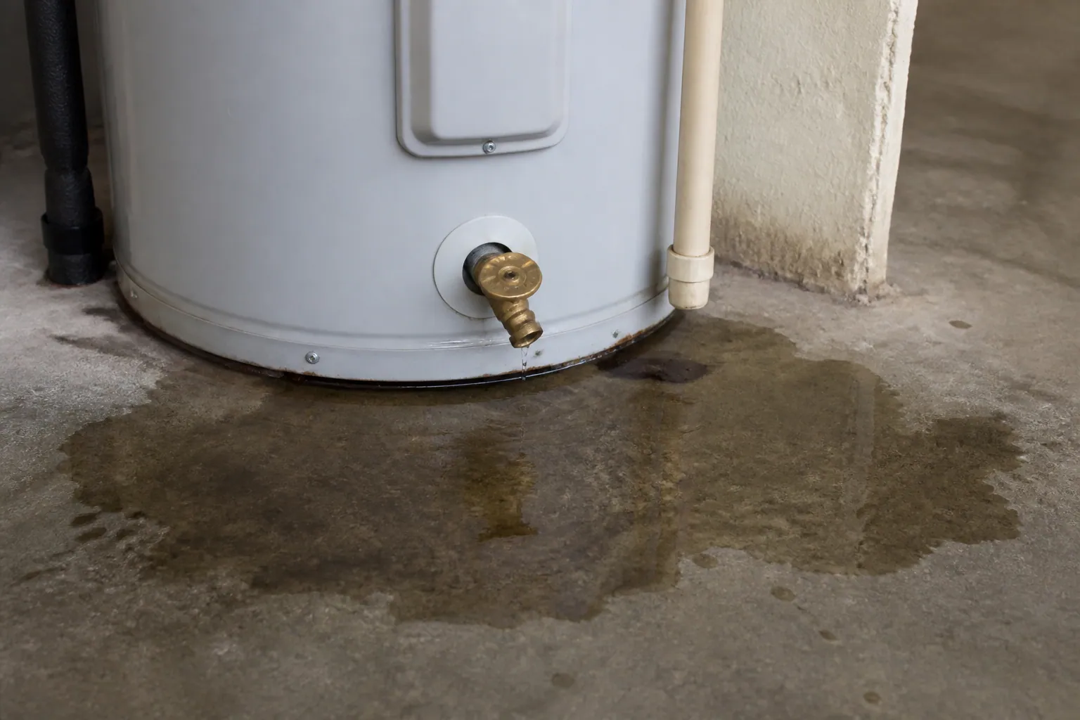 Water heater leaking at the base in a Lakeland garage, a same-day water heater repair call